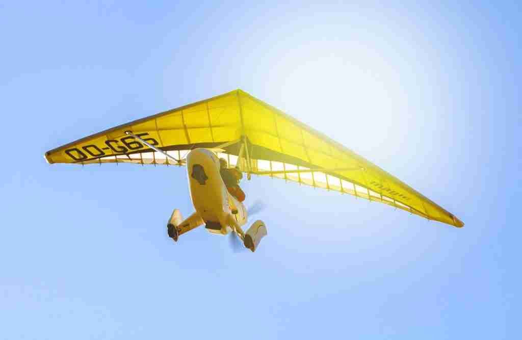 Ultralight aircraft flying in sky